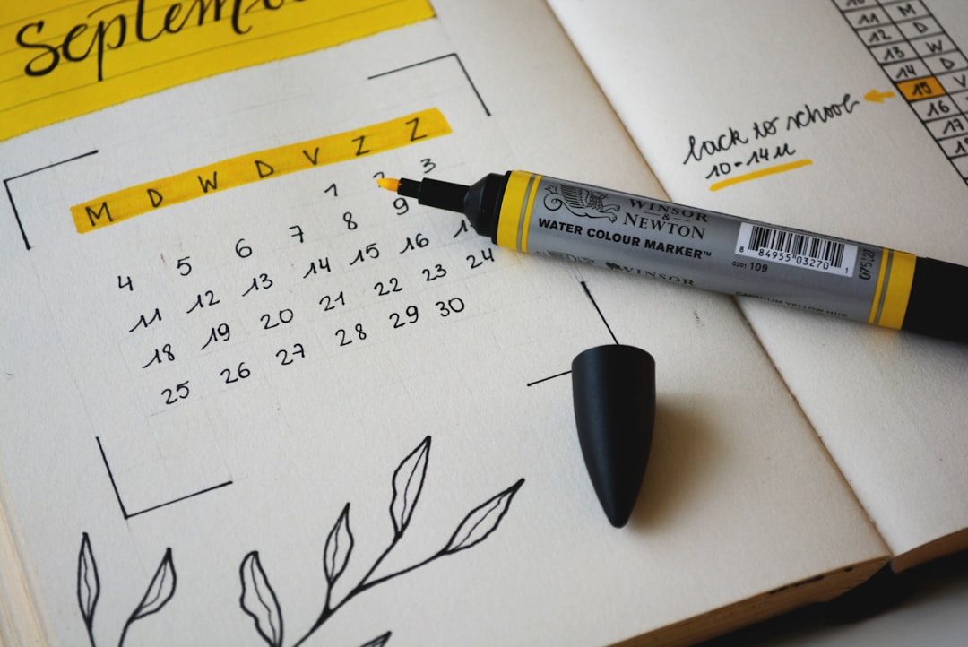 Bullet journal with black marker — representing the summer accreditation checklist and preparation before fall